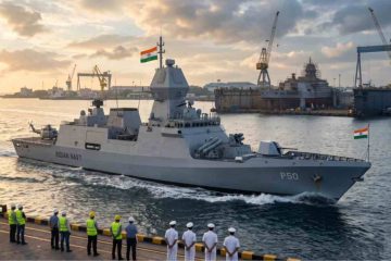 Indian Navy Next-Generation Corvette warship departing a shipbuilding dockyard during golden hour.